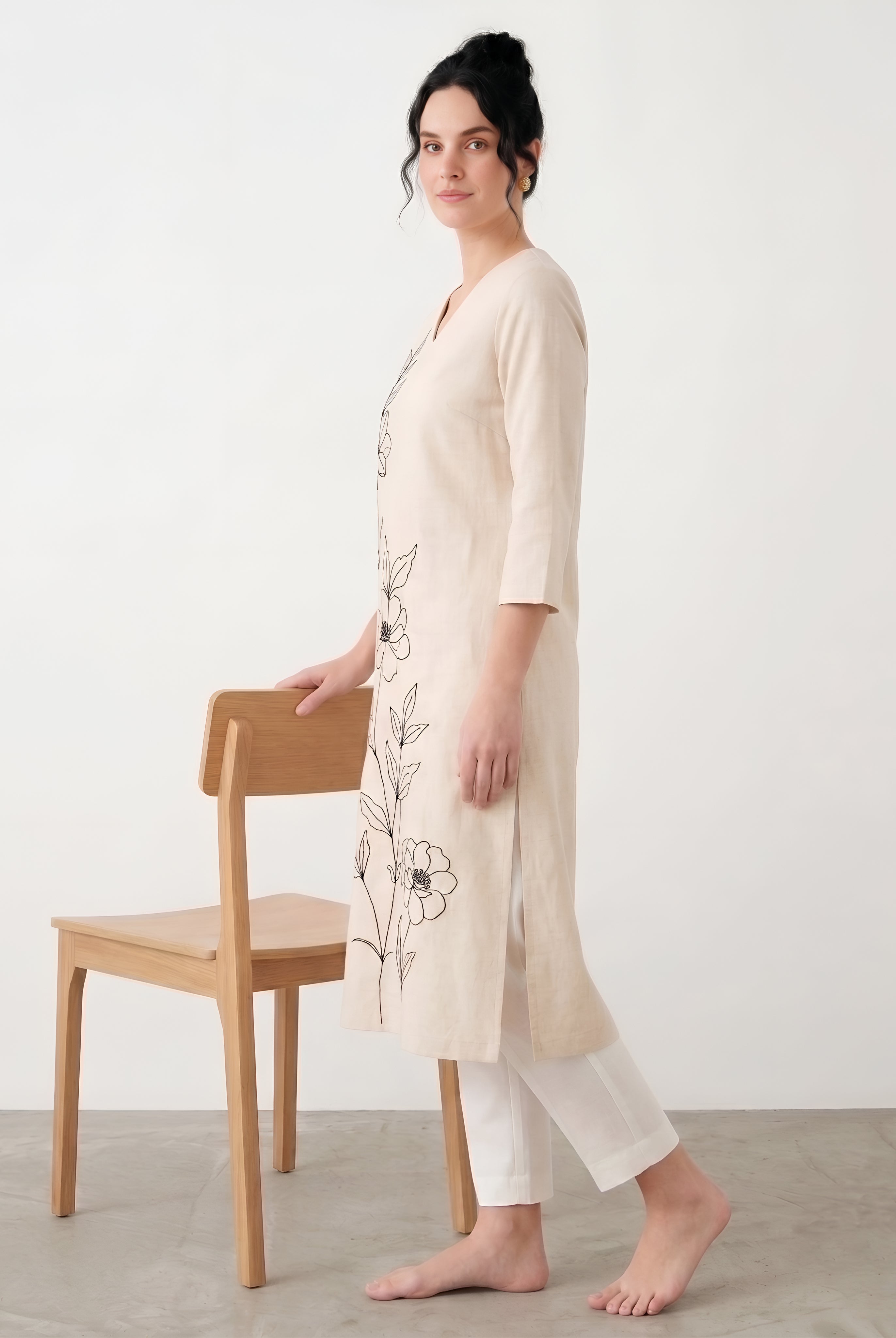 Close up floral embroidery design on ivory cotton kurta
