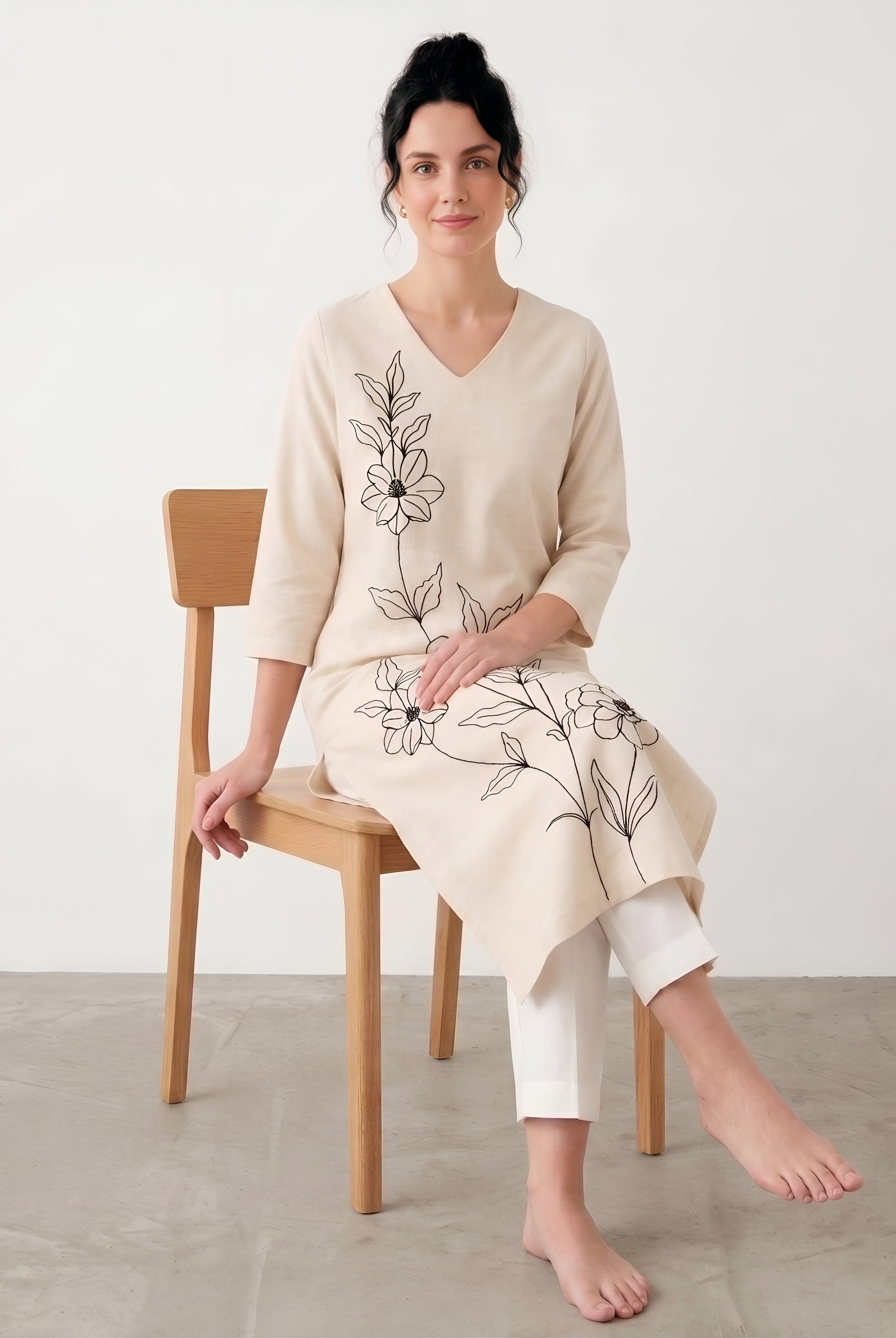 Women wearing ivory ethnic cotton kurta with straight pants