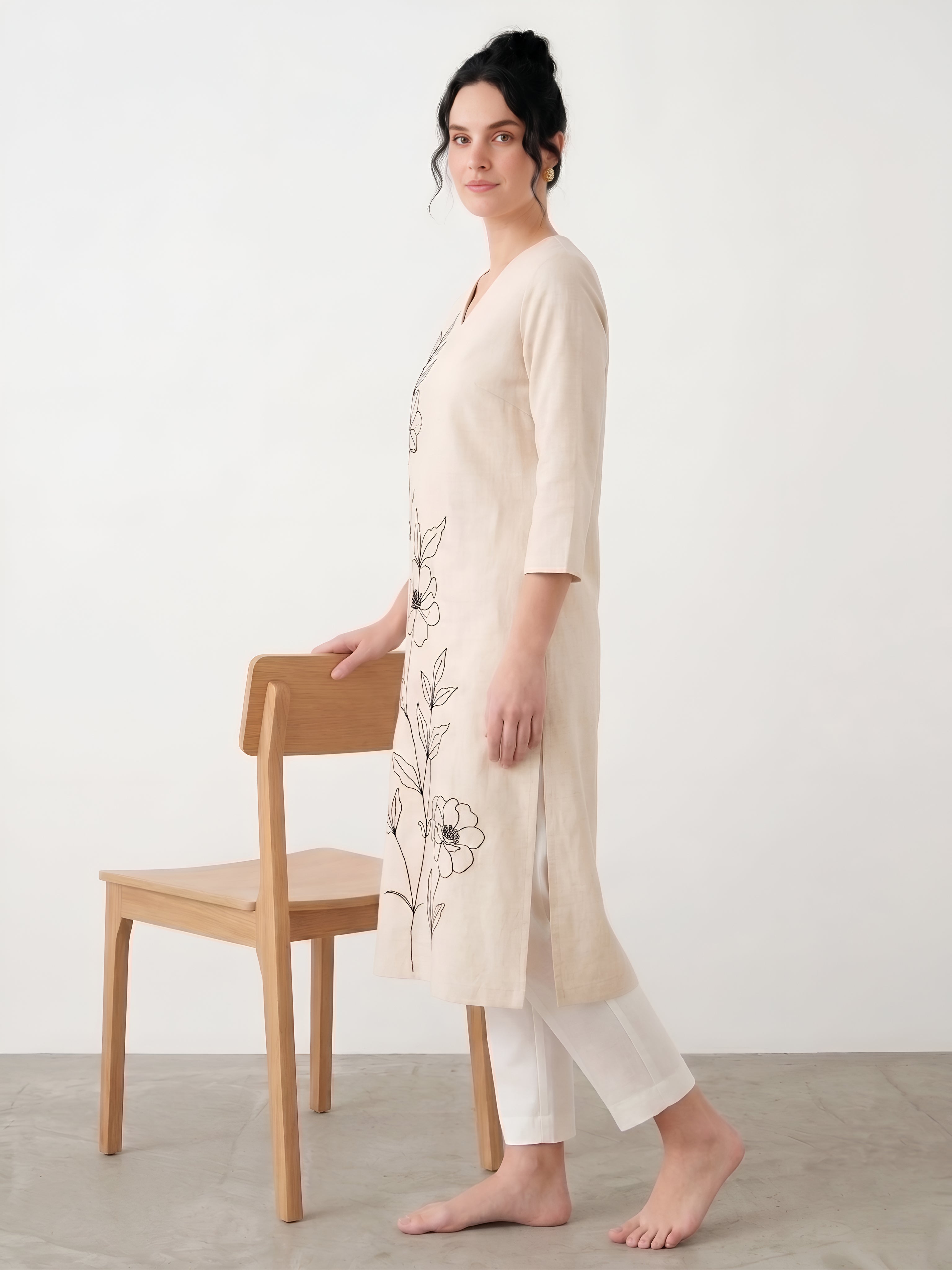 Close up floral embroidery design on ivory cotton kurta